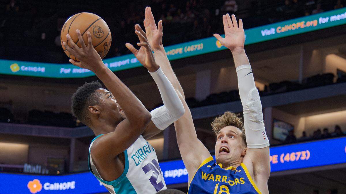 The Charlotte Hornets’ Brandon Miller (24), the No. 2 overall selection in the 2023 NBA Draft, puts up a shot over the Golden State Warriors’ Mikael Jantunen (18) during the California Classic on Wednesday, July 5, 2023, at Golden 1 Center. The two-day summer league tournament features teams composed of NBA rookies, second-year players and athletes competing to make NBA and G League regular season rosters.