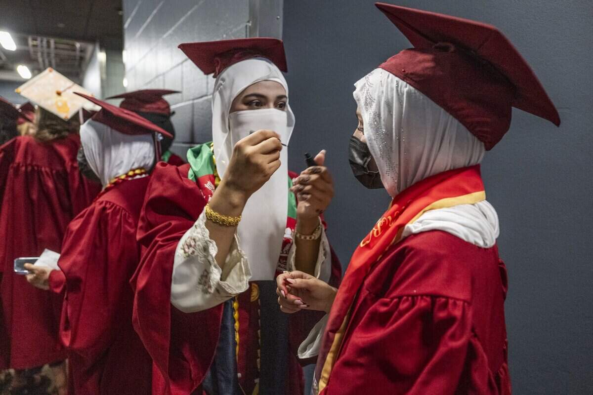 C.K. McClatchy High School students work on their make up as they participate in the first graduation ceremony for Sacramento City Unified School District at Golden 1 Center on Monday, June 8, 2026.