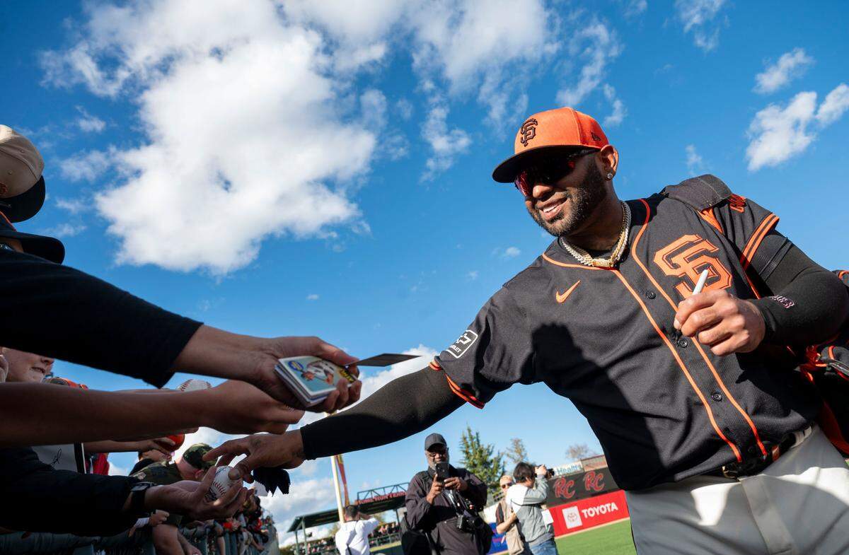 Pablo Sandoval signs autographs for fans as the San Francisco Giants played the Sacramento River Cats in an exhibition game Sunday at Sutter Health Park.