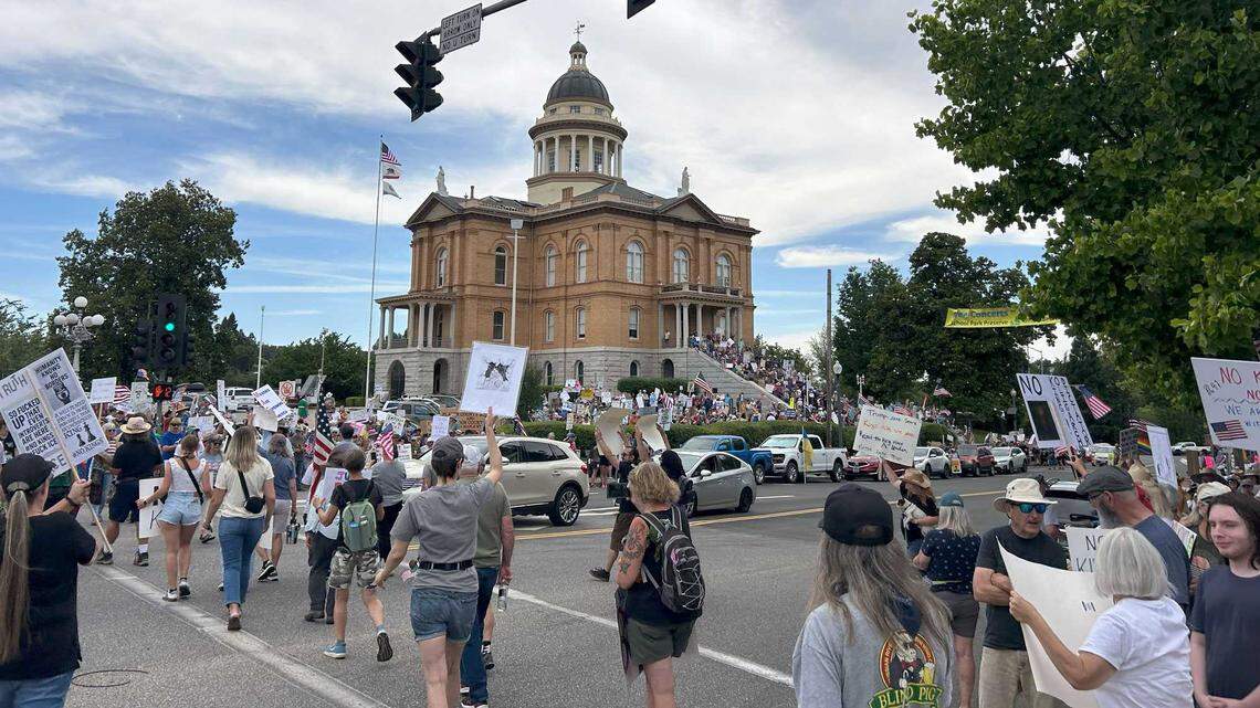Protesters march at the historic courthouse in Auburn as part of the nationwide series of “No Kings” rallies, Saturday, June 14, 2025. At least 500 people participated in the event.
