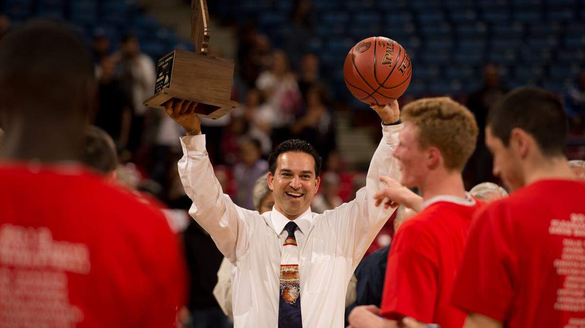 Pleasant Grove coach John DePonte holds up the championship trophy following the CIF State Division I championship game against Santa Monica on March 22, 2013, at Sleep Train Arena in Sacramento.