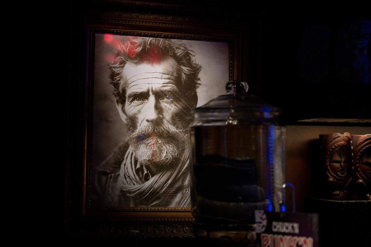 A photograph of "Elias Hawthorne" sits near the bar on Thursday. The supposed explorer is the namesake of Hawthorne’s Hideout, an immersive underground speakeasy in Old Sacramento.