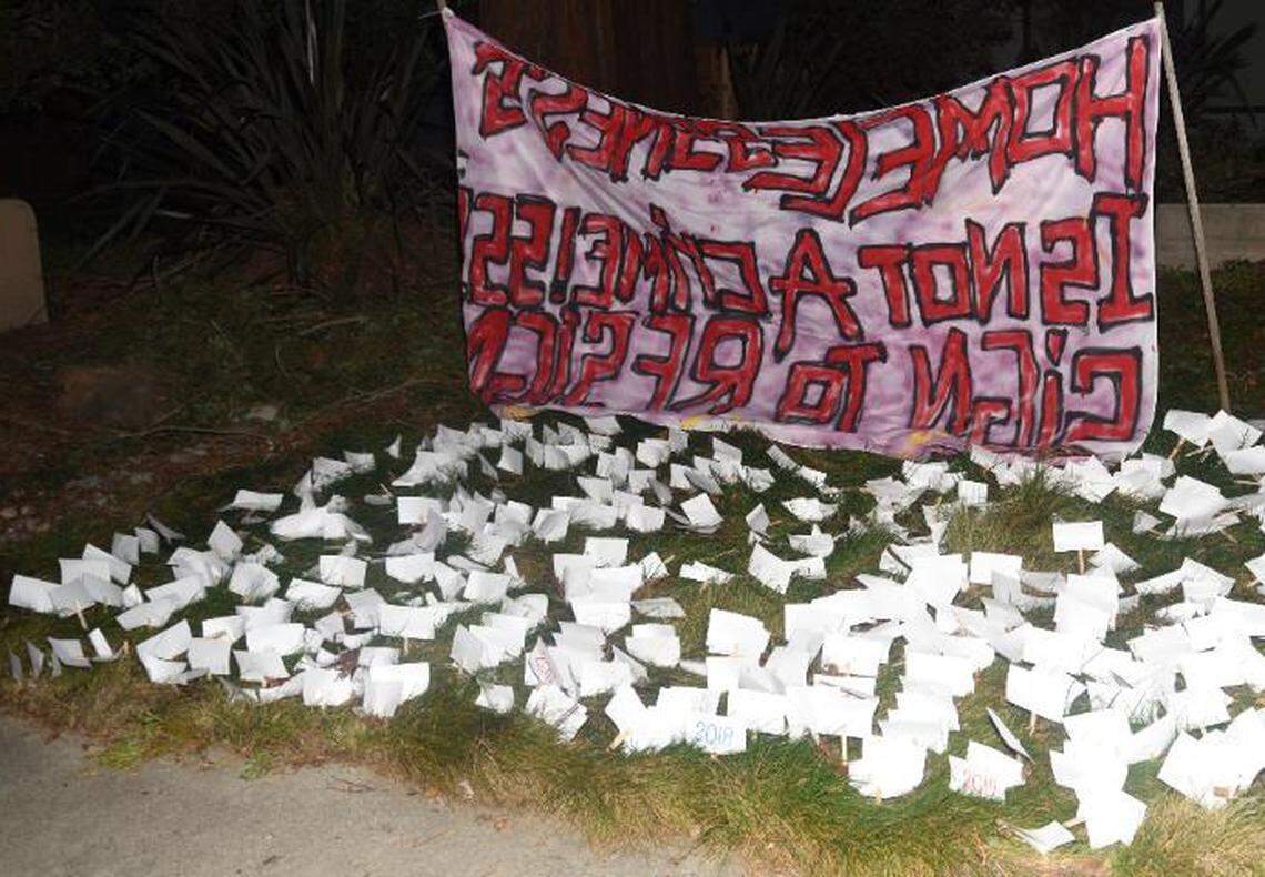 An image from the Sacramento Police Department shows a banner and papers left by activists who vandalized the home of Sacramento Mayor Darrell Steinberg on Saturday, Feb. 6, 2021.