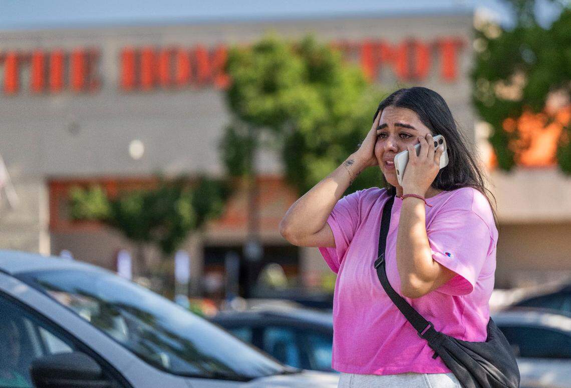 Andrea Castillo speaks to a relative after her husband, U.S. citizen Jose Castillo, was taken into custody by masked uniformed men from the U.S. Border Patrol at the Home Depot on Florin Road near Highway 99 in south Sacramento on Thursday, July 17, 2025. Castillo said that her husband called her saying he was recording the men on the parking lot. ”If he wasn’t brown, he wouldn’t have been questioned,” Castillo said.