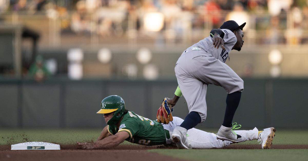 Athletics base runner Colby Thomas is tagged out by New York Yankees second baseman Jazz Chisholm Jr. for the third out in the bottom of the fourth inning on Friday at Sutter Health Park in West Sacramento.