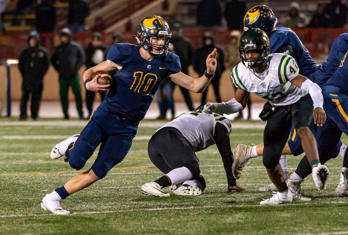 Oak Ridge Trojans Justin Lamson (10), runs with the ball as the Oak Ridge Trojans play the Monterey Trail Mustangs in the Sac-Joaquin Section Division I final Football game at Hughes Stadium in Sacramento, Saturday, November 30, 2019.