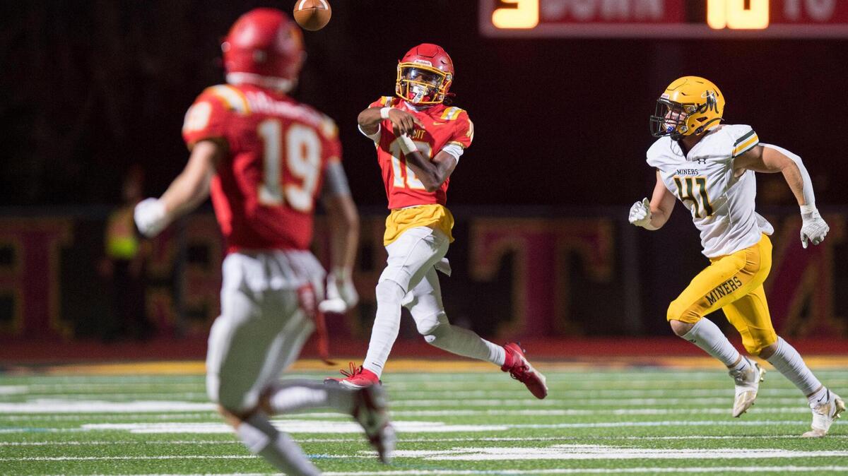 Jesuit Marauders quarterback CJ Lee (10) throws the ball to wide receiver Jonah Luhrsen (19) during the second half of the high school football game at Jesuit High School on Friday in Carmichael.