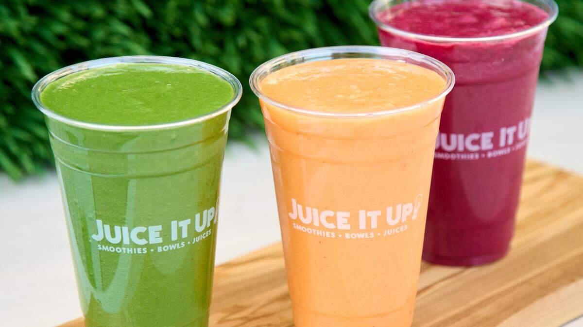 Smoothies from Juice It Up are staged behind a green background. The juice bar franchise will open a Roseville location in fall 2024 at 6706 Stanford Ranch Road with smoothies, juices, acai bowls and small bite
