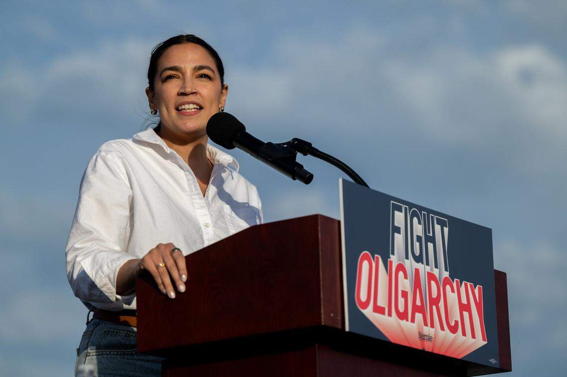 Congresswoman Alexandria Ocasio-Cortez speaks during her Fighting Oligarchy tour with Bernie Sanders at Folsom Lake College on Tuesday.