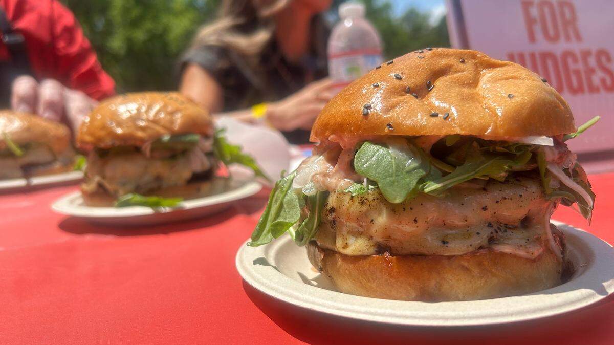 One of the burgers that well-known injury attorney Anh Phoong, who is in the background, and other prominent judges ranked at the American River Parkway Foundation’s burger battle at Discovery Park on Saturday.
