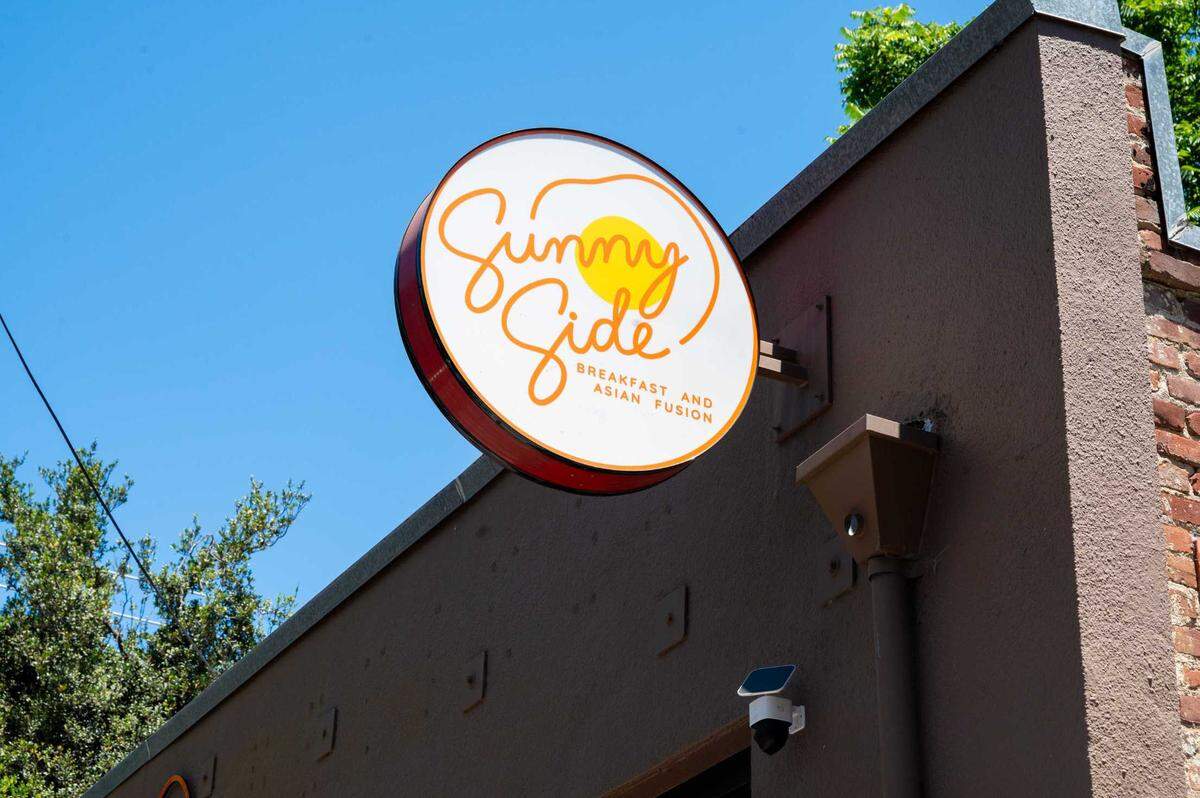 Signage at Sunny Side Breakfast is seen in midtown Sacramento on Tuesday. The family-run eatery draws on Thai, Korean and Japanese influences to create a unique breakfast menu.