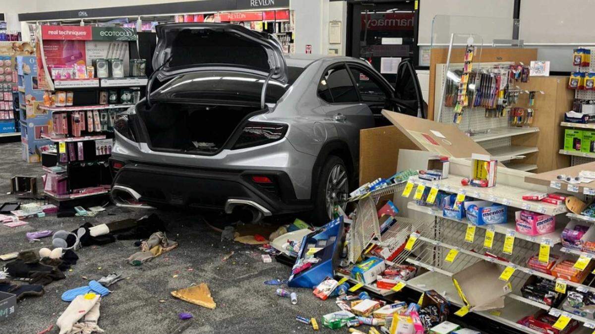 A stolen Subaru sits inside a North Auburn CVS store after deputies said a driver crashed through the entrance in an apparent burglary attempt Thursday.