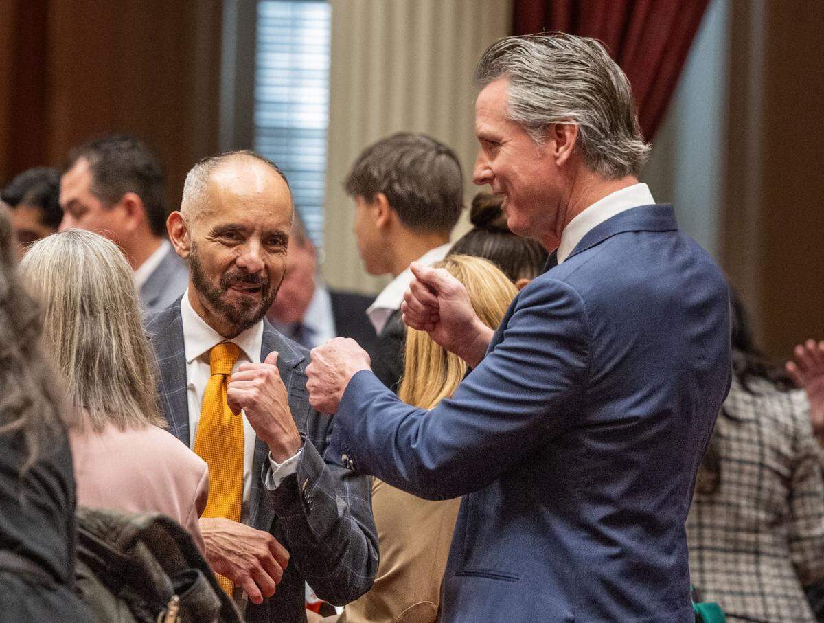 Newly elected Sen. Christopher Cabaldon, D-West Sacramento, and Gov. Gavin Newsom have a friendly conversation before members of the California Senate are sworn in on Monday. Cabaldon was the longtime mayor of West Sacramento.