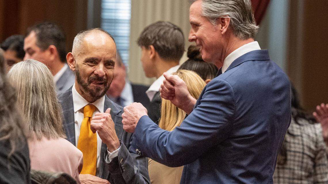 State Sen. Christopher Cabaldon, D-West Sacramento, and Gov. Gavin Newsom have a friendly conversation before members of the California Senate are sworn in on Monday, Dec. 2, 2024, at the state Capitol. 
