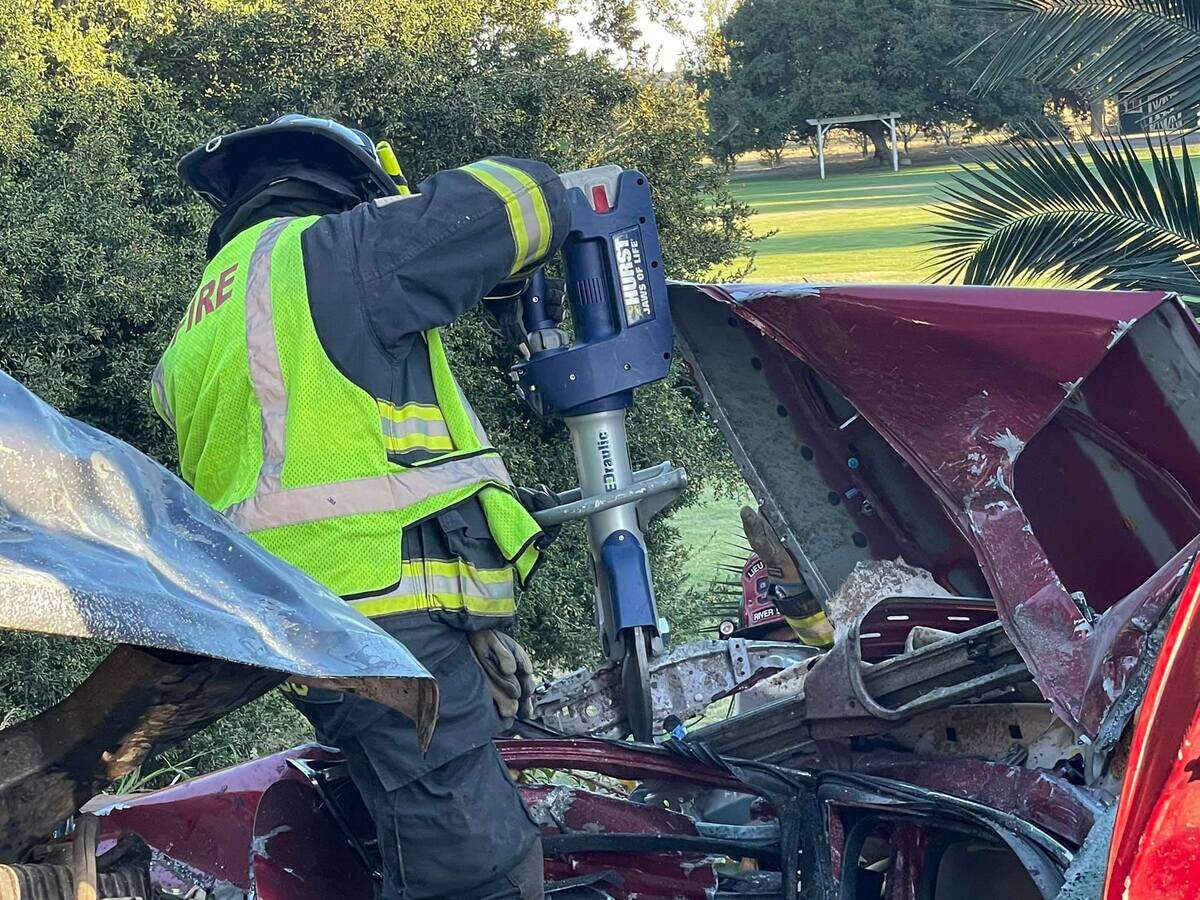 Firefighters work to extricate a patient.