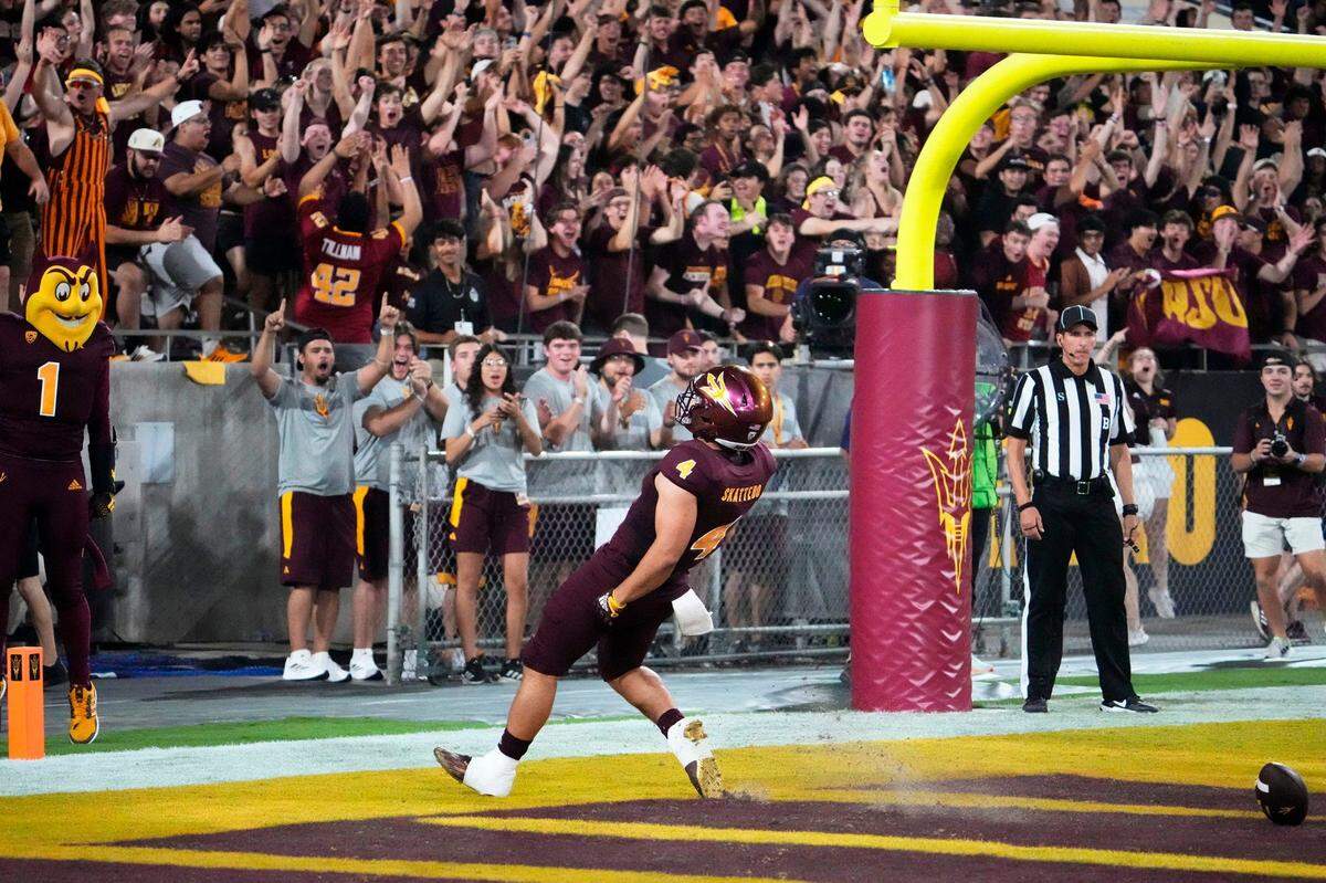 Arizona State Sun Devils running back Cameron Skattebo (4) rushes for a touchdown against the USC Trojans in the first half Saturday, Sept. 23, 2023, at Mountain America Stadium in Tempe, Arizona.