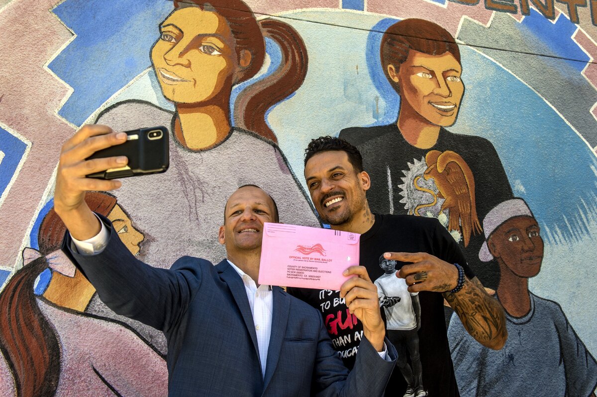 Former NBA player Matt Barnes poses for a selfie for Assemblyman Kevin McCarty after a press conference where he urged everyone to vote at the Oak Park Community Center in Sacramento, on Monday, June 4, 2018.