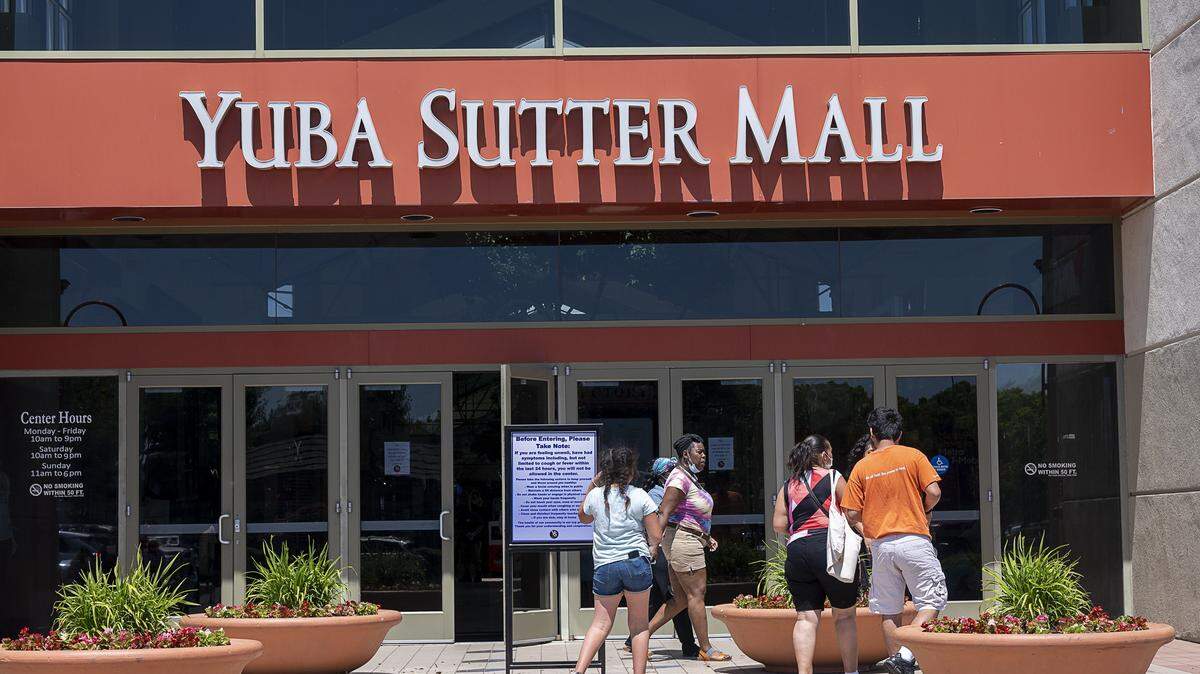 Shoppers enter and exit the Yuba Sutter Mall on Wednesday, May 6, 2020.