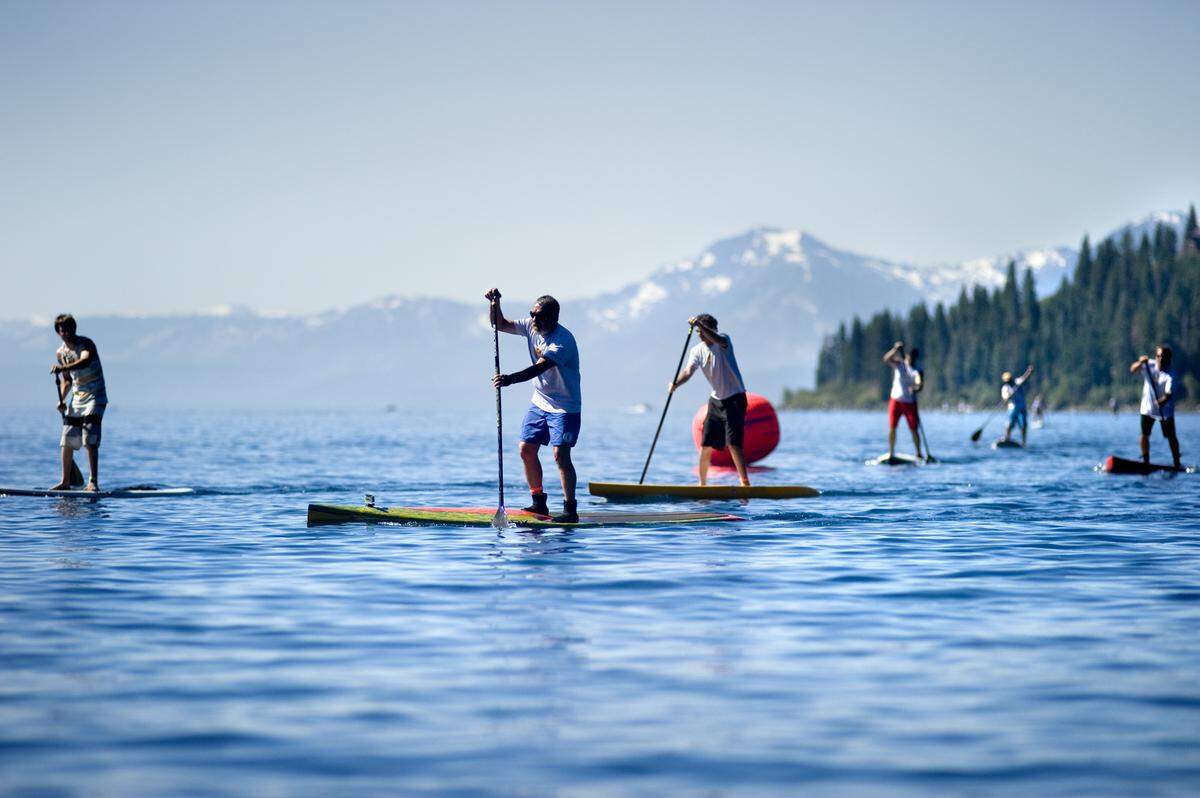 Paddleboarders compete in the Lake Tahoe Paddleboard Association’s “Jam From the Dam,” a 6-mile long race along the north shore of Lake Tahoe. Second paddler from the left is the owner of Tahoe Paddle & Oar, Phil Segal. The shop, which rents stand-up boards to people for $20 an hour, is located on the north shore of Lake Tahoe in Kings Beach, Calif. July 10, 2010.