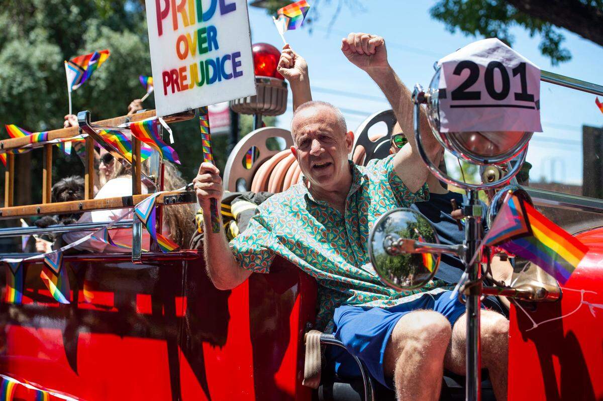 Mayor Darrell Steinberg rides with the Sacramento Fire Department during the Sacramento Pride March and Parade on Sunday, June 11, 2023.