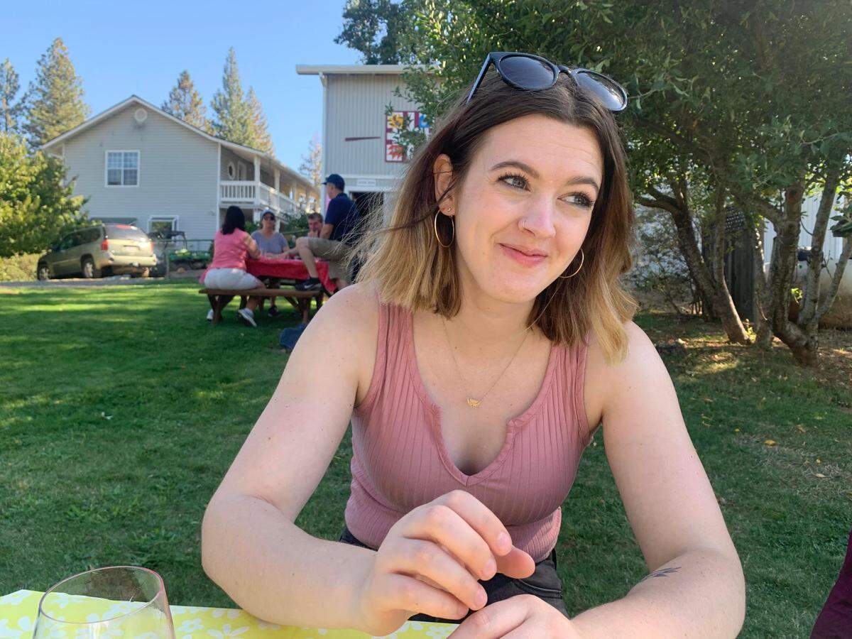 Savanna Smith, an editor at The Bee, enjoys time with friends at Wofford Acres Vineyard on Apple Hill on Saturday.