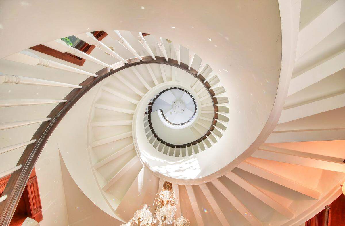 A sprial staircase leads up to a domed turret.