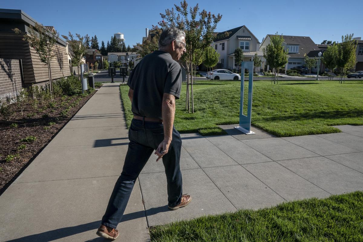 Developer Phil Angelides walks through a park in his McKinley Village development in 2018. Angelides said the CEQA challenge to the development added $1.5 million to the project’s expense, and “several thousand dollars” to the cost of each home at McKinley Village.
