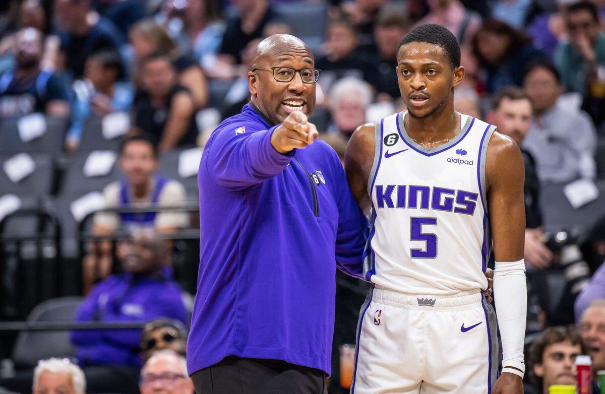 Sacramento Kings head coach Mike Brown talks with guard De’Aaron Fox (5) during the first half against the Los Angeles Lakers at the preseason NBA basketball game Friday, Oct. 14, 2022, at Golden 1 Center in Sacramento. The Kings fired Brown in December 2024 and traded Fox to the Spurs in a three-team deal this week.