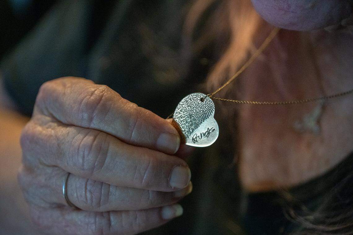 Cheryl Pringle wears a heart-shaped necklace engraved with her son Andrew Pringle’s fingerprint and signature on May 19 in Rosemont. The other side reads, “We may be apart, but I will always be close to your heart.”