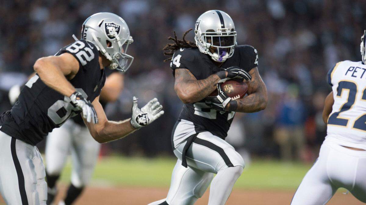 Raiders running back Marshawn Lynch (24) runs against the Los Angeles Rams during the season opener Sept. 10 at the Coliseum. The Raiders placed Lynch on injured reserve Monday. He’s not eligible to return until Christmas Eve.