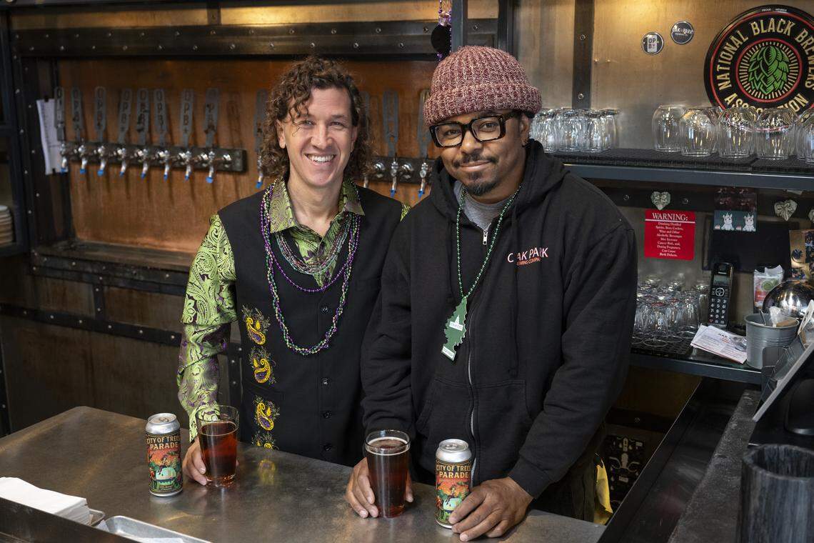 Wes Samms, lead organizer of the City of Trees Parade, poses for a portrait with Rodg Little, co-owner and brewer at Oak Park Brewing, at the brewery in Sacramento on Feb. 19.