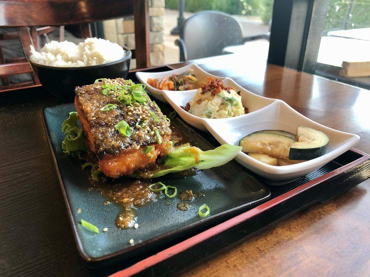 Kuji Asian Grill’s salmon plate lunch comes with potato macaroni salad, pickles, rice and kimchi.