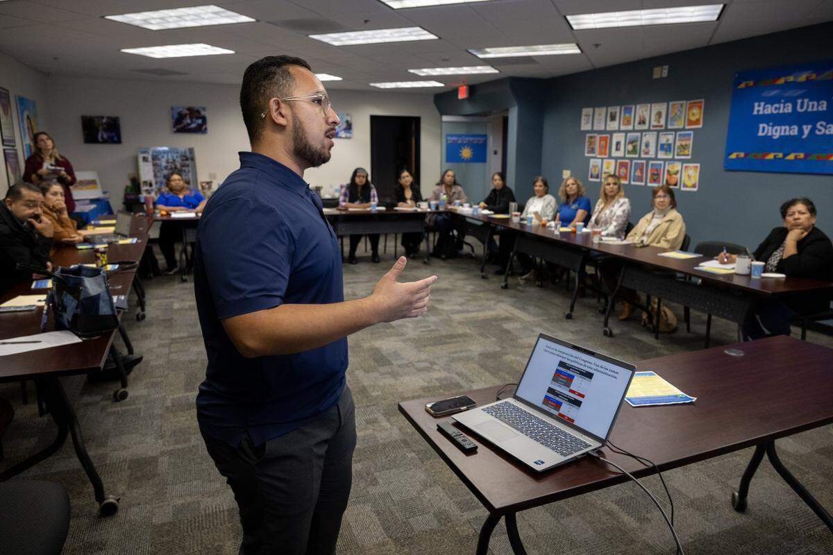 Noe Garcia, a California Democratic Party regional director, speaks to a group of voters at a Visión y Compromiso meeting about Proposition 50 on Oct. 22 in Bakersfield. Garcia said that many Latinos oppose abortion and feel aligned with the Republican Party on the issue, but Democrats need to better communicate their support for many programs that the Latino community relies on – including SNAP, EBT, and funding for schools and financial aid for college.