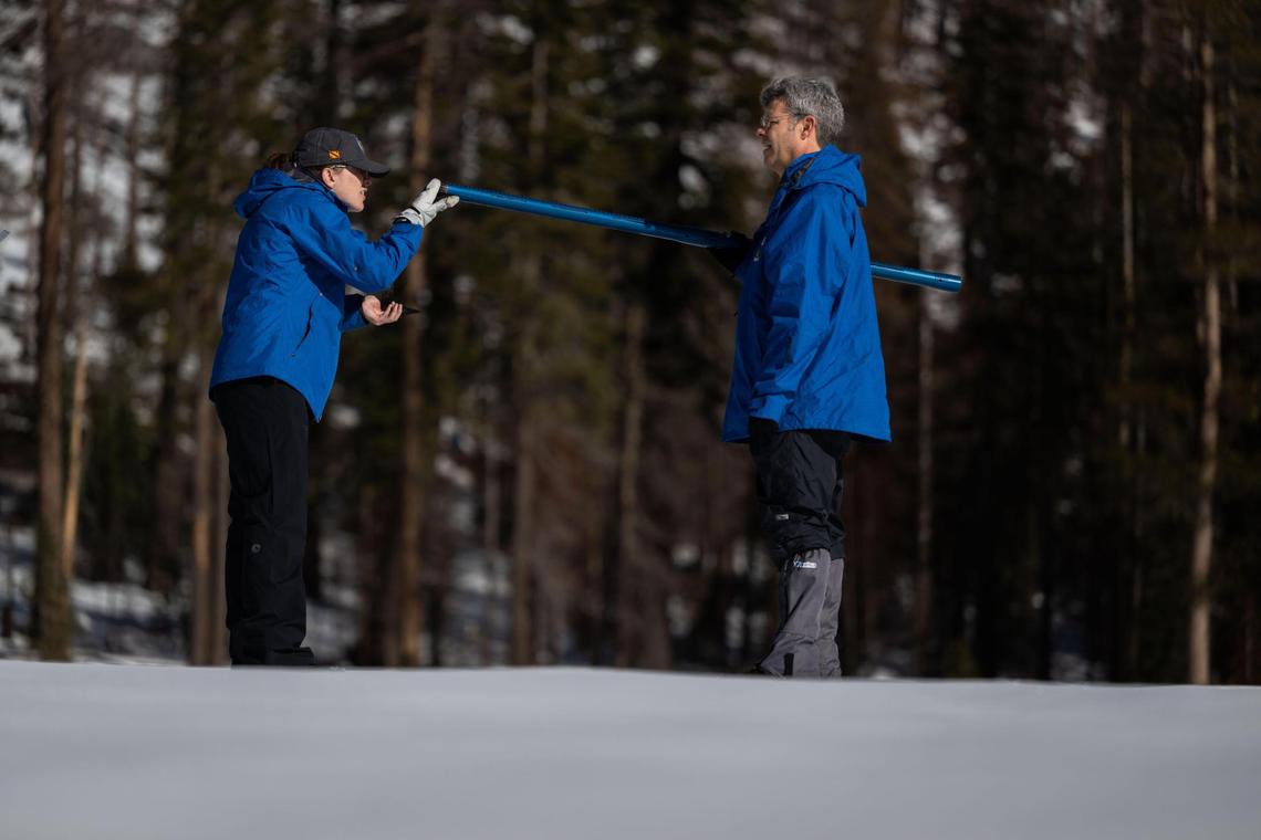 Department of Water Resources engineer Jordan Thoennes, left, checks a snow measuring tool as Andy Reising, manager of the snow Surveys and Water Supply Forecasting Unit, takes a reading Thursday at Phillips Station.