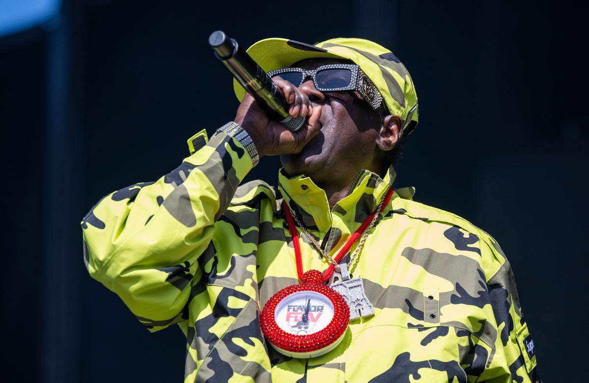 Rapper Flavor Flav performs with Public Enemy, still wearing a Flavor Flav kitchen timer necklace from a cooking demonstration earlier in the day, during the BottleRock music festival in Napa on Friday, May 23, 2025. 