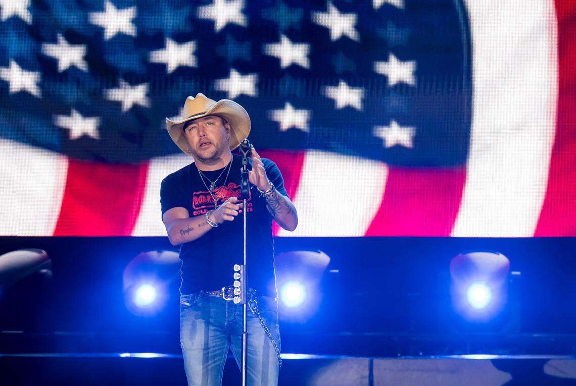 Jason Aldean finishes singing “Tough Crowd” as a U.S. flag lowers on the display behind him during his Highway Desperado tour concert in September at Toyota Amphitheatre in Yuba County, California.