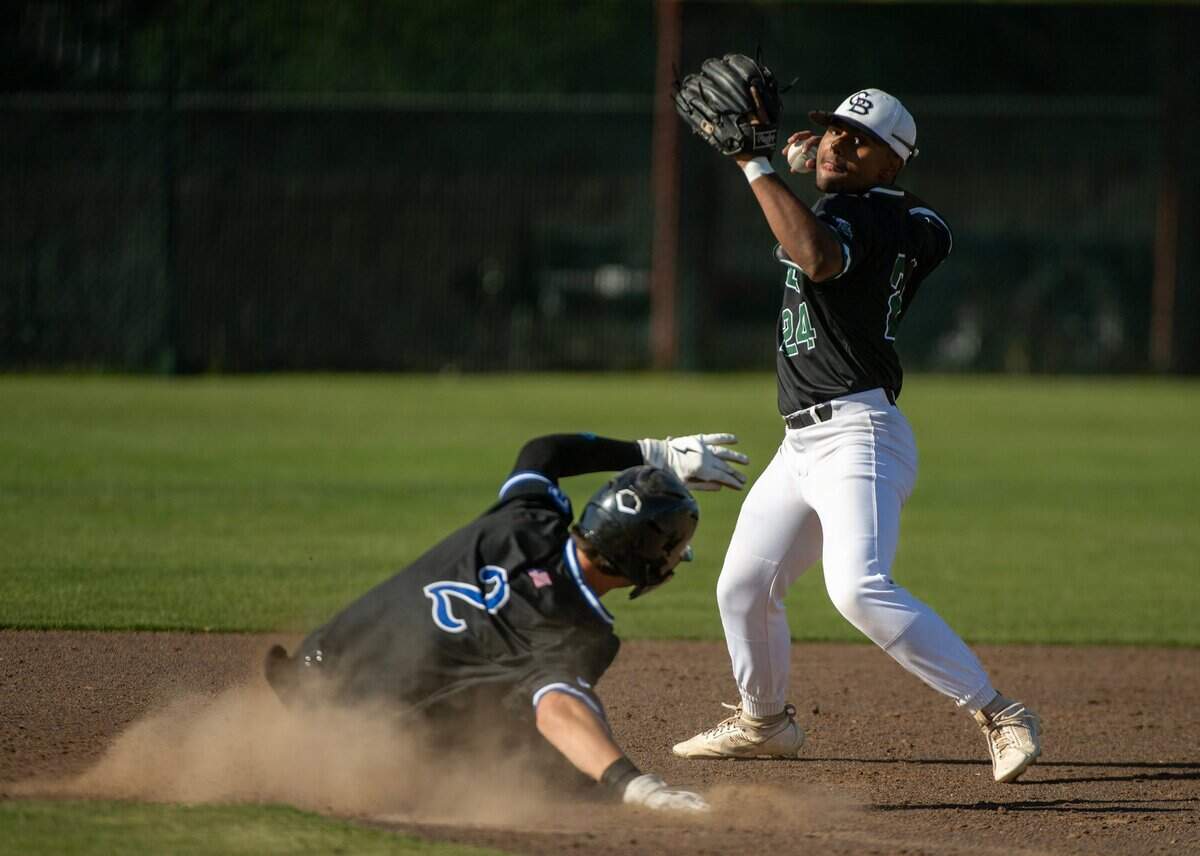 Granite Bay second baseman Brendon Pops gets a throw off past Rocklin baserunner Joey Lorenzini in a game on Thursday, May 2, 2024, at Granite Bay High School.