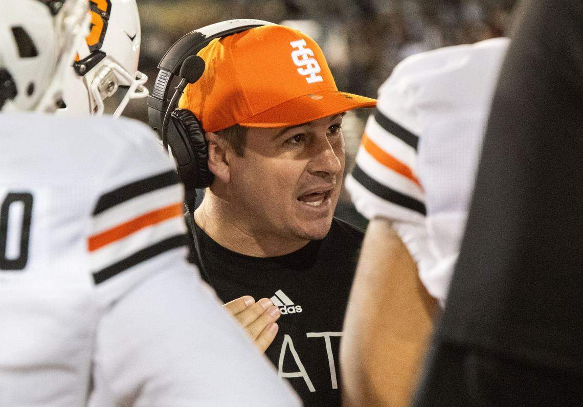 Idaho State first-year head coach Cody Hawkins talks to his players during a football game against Sacramento State at Hornet Stadium on Oct. 28. Hawkins will coach against his father, UC Davis head coach Dan Hawkins, on Saturday.