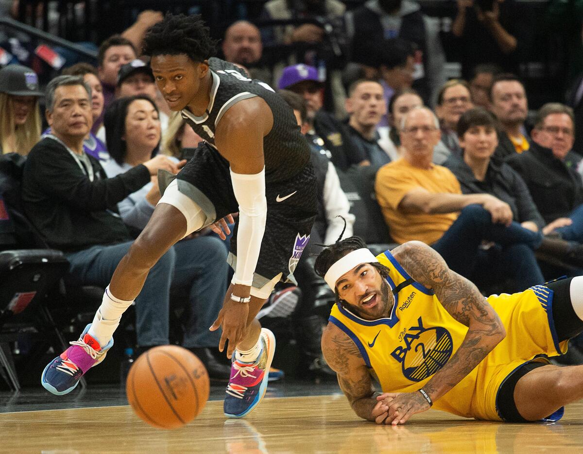 Sacramento Kings guard De’Aaron Fox (5) steals the ball from Golden State Warriors center Willie Cauley-Stein (2) during a game at Golden 1 Center on Monday, Jan. 6, 2020 in Sacramento.