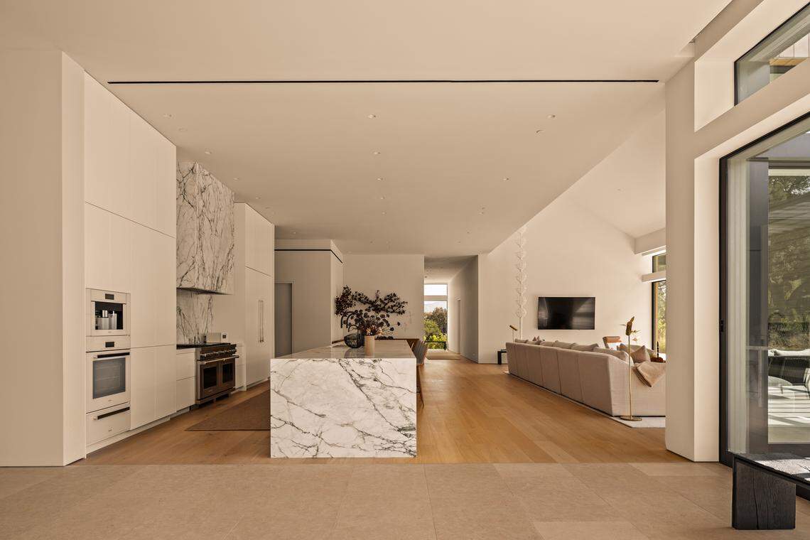 Resort-style amenities include a sparkling pool and spa, gardens, drought-resistant lawns, and spacious patios designed for seamless indoor-outdoor gatherings.