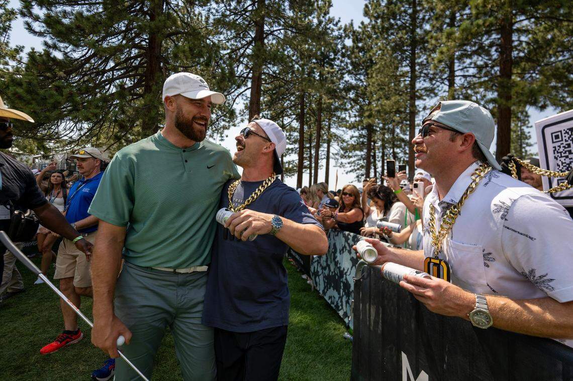 Travis Kelce embraces a fan as he makes his way to the 18th tee in the first round of the American Century celebrity golf championship on Friday, July 12, 2024, in Stateline, Nev.
