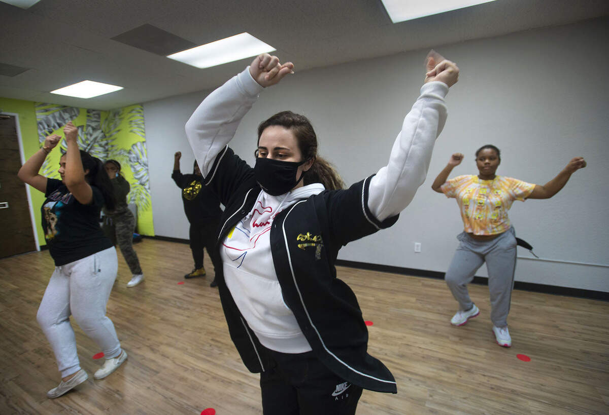 Hannah Feuerwerker, front, teaches hip hop dancing to students at Studio T Arts and Entertainment on Friday, Nov. 17. Studio T Arts is a grassroots nonprofit that recently opened a youth driven media lab to teach youth valuable workforce skills while earning money as “youthpreneurs.“