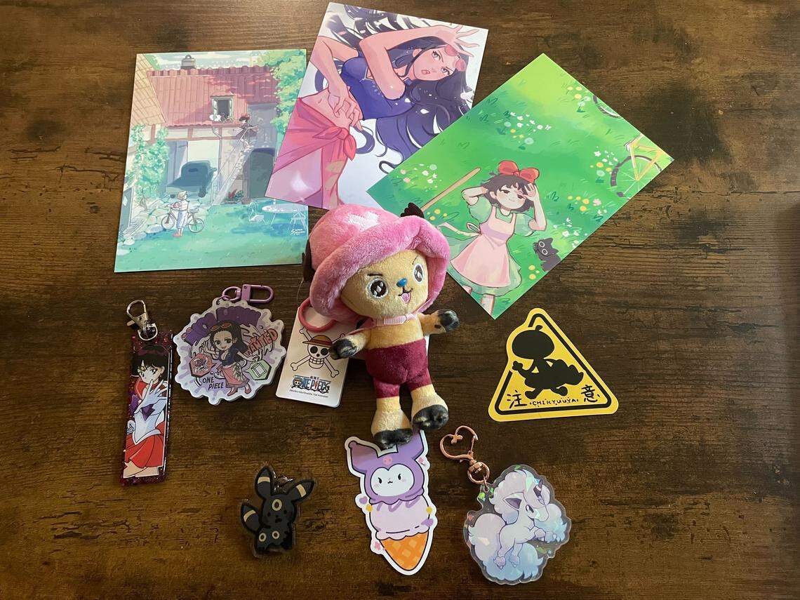 Keychains, art and stickers purchased at SacAnime Spring on April 24, 2026. The convention has a variety of merchandise available from 350 vendors.