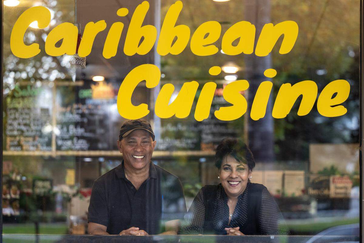 Ken Chan and Debbie Rajkumar, owners of Cafe Connection, pose for a portrait inside their restaurant in Sacramento on Wednesday.
