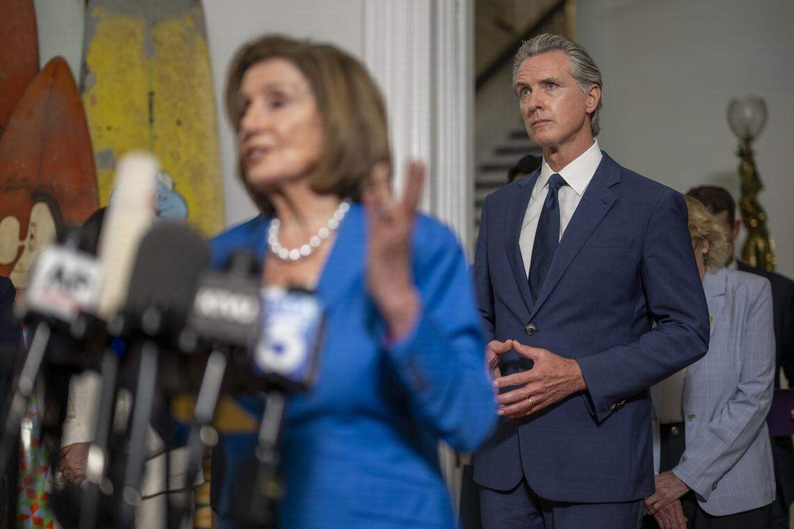 Gov. Gavin Newsom looks on as Speaker Emerita Rep. Nancy Pelosi, D-San Fransisco, delivers remarks during a news conference on redistricting at the Governor's Mansion in downtown Sacramento on Aug. 8. California legislative leaders met with Texas Democratic lawmakers about Republican plans to redistrict.