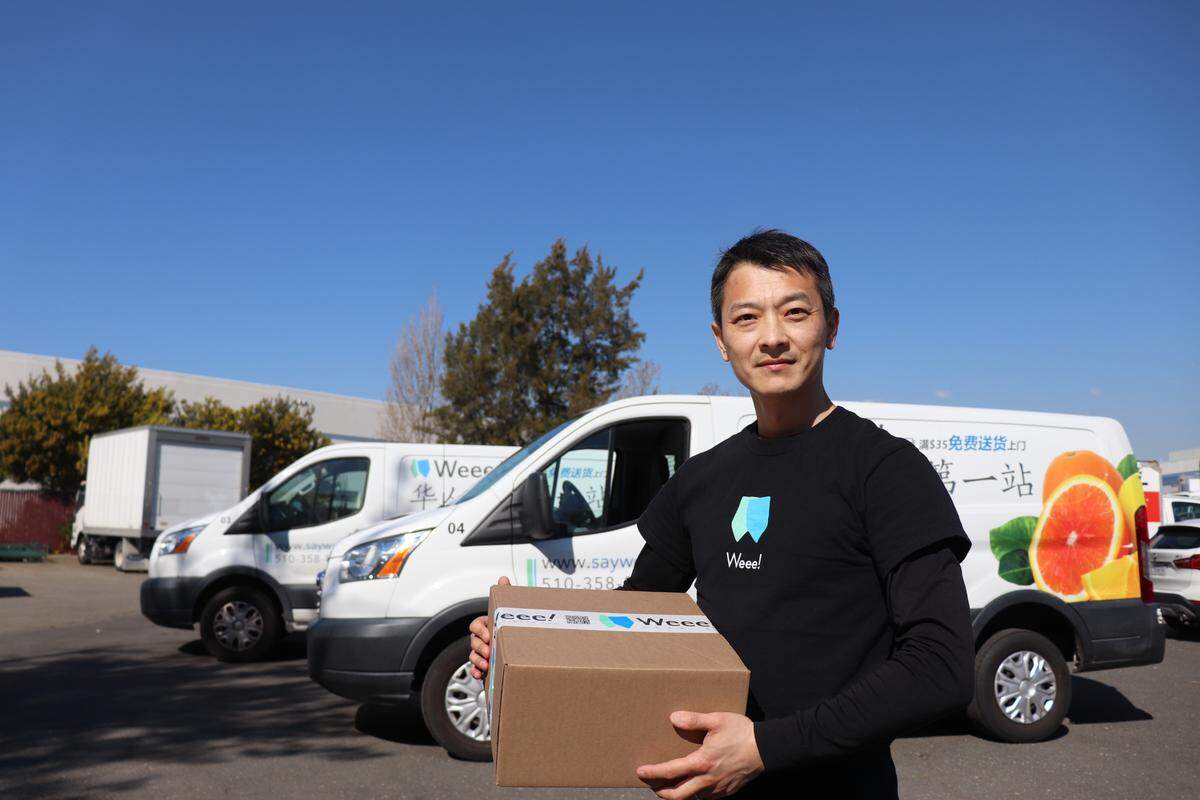 Wee’s warehouse manager Tommy Ma stands in front of the delivery vans in Fremont, California on Oct. 21 2019.