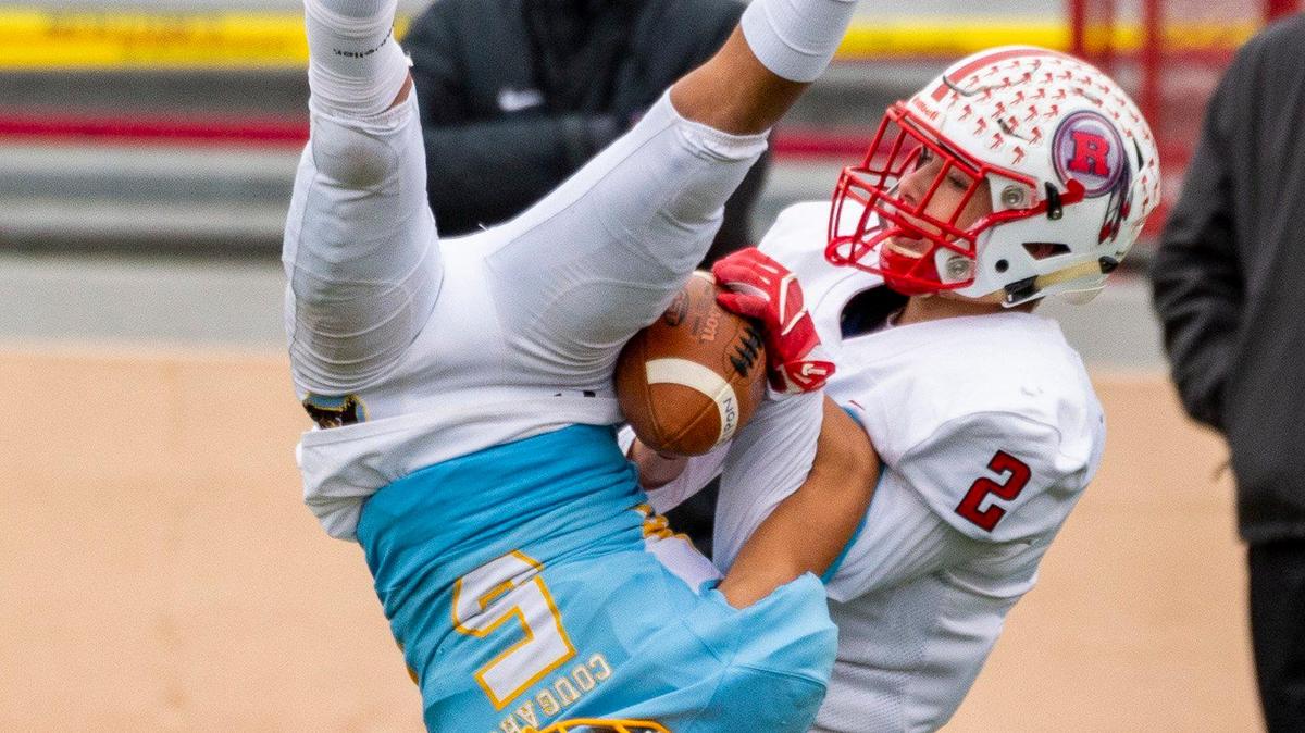 Center High School Cougars Cam Denham (5), intercepts the ball intended for Ripon Indians Brandon Rainer (2), during the second quarter as the Center High School Cougars host the Ripon Indians in the Sac-Joaquin Section Division V final Football game at Hughes Stadium in Sacramento, CA., Saturday, November 30, 2019.
