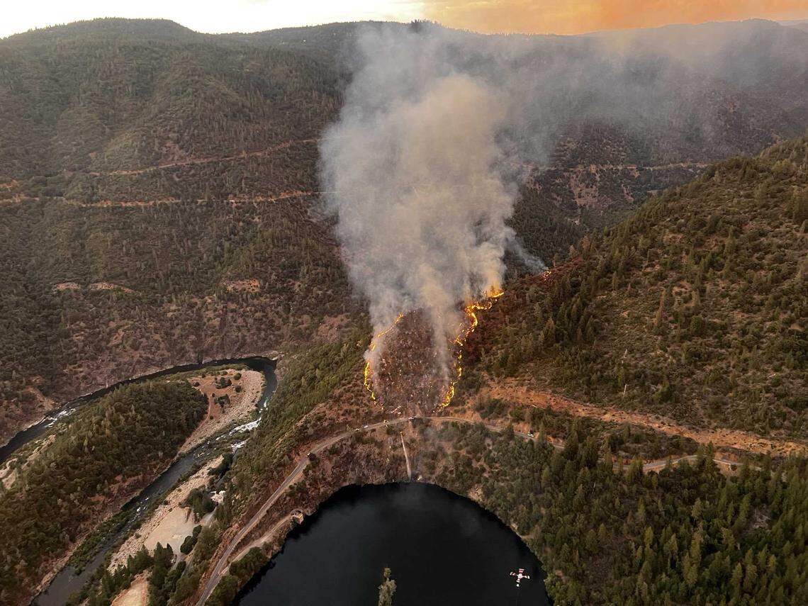 The Mosquito Fire is seen burning Tuesday, Aug. 6, 2022, in the Tahoe National Forest just above Oxbow Reservoir, about 4 miles east of Foresthill. The Placer County Sheriff’s Office issued mandatory evacuations for homes near the blaze.