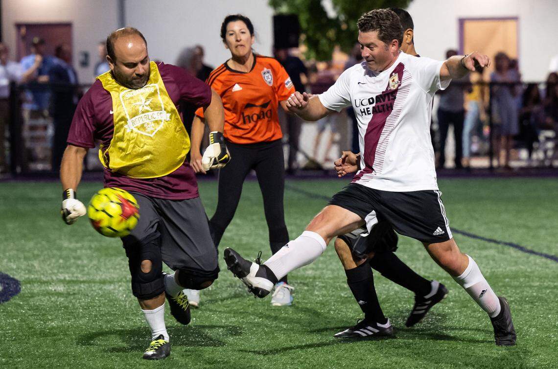Northern California player Assemblyman Jordan Cunningham, right, R-San Luis Obispo, gets a shot past Southern California goalkeeper Assemblyman Adrin Nazarian, D-Los Angeles, but misses the net during the Capitol Cup charity soccer game Wednesday at Cristo Rey High School in Sacramento. Northern California beat Southern California 5-2.