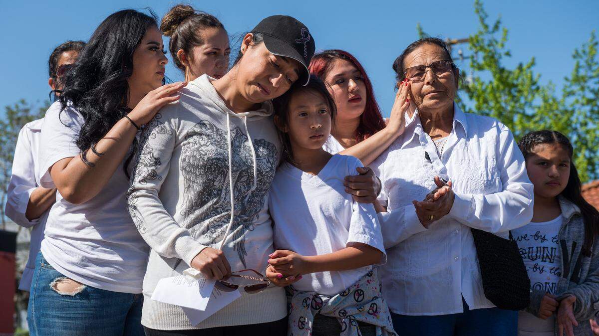 Erika Mosqueda comforts her daughter Ninel, 10, as she stands with family members Jhisel Mosqueda, left, and Antonia Carolina Cisneros right, outside of the Yuba County Jail on Sunday, April 8, 2018, in Yuba City, Calif., after her husband, Isaias Mosqueda Cisneros, of Auburn was detained by ICE while on his way to work.